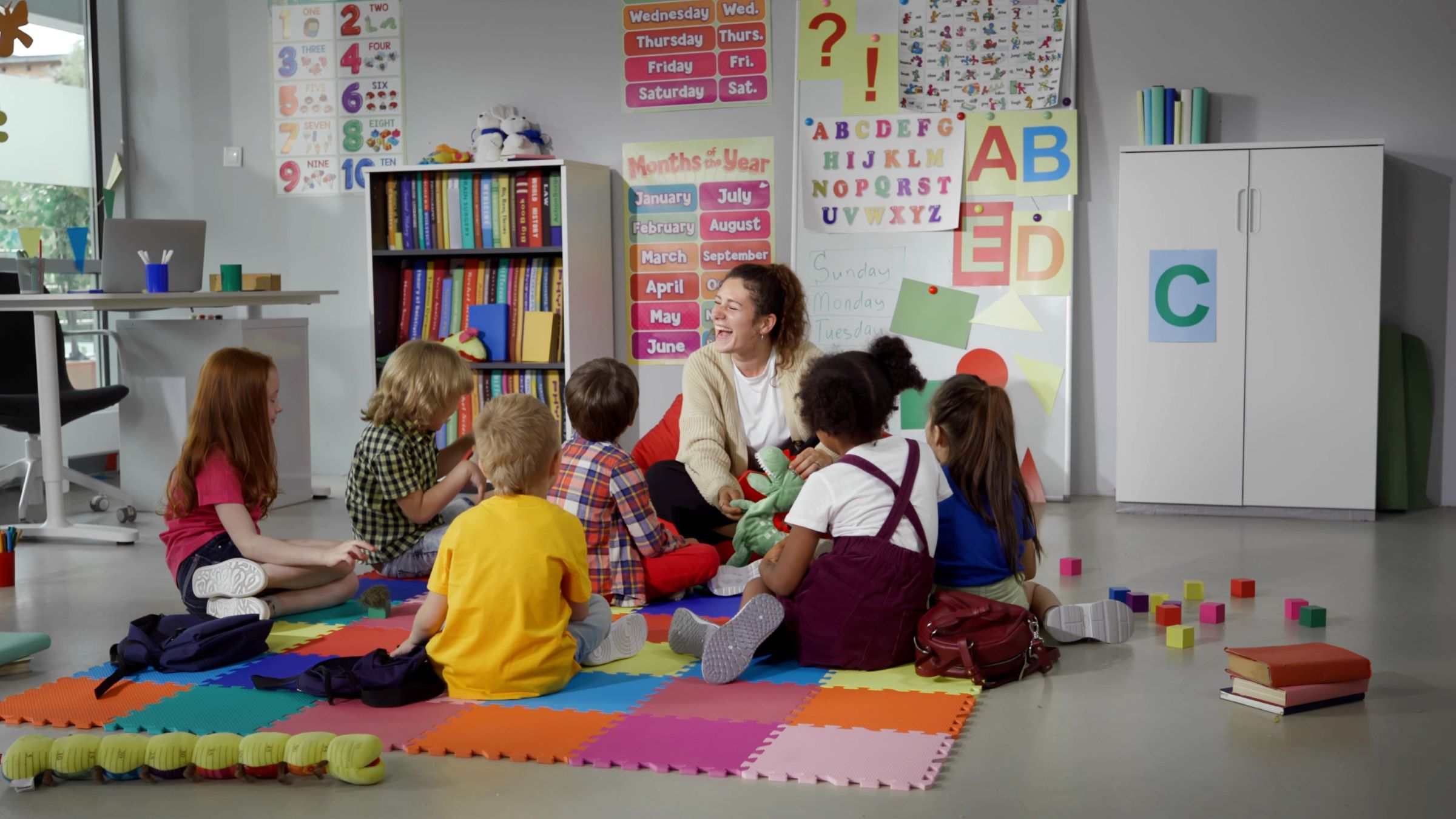Preschool students engaging in daily circle time to build social skills and community in a well-equipped Head Start classroom