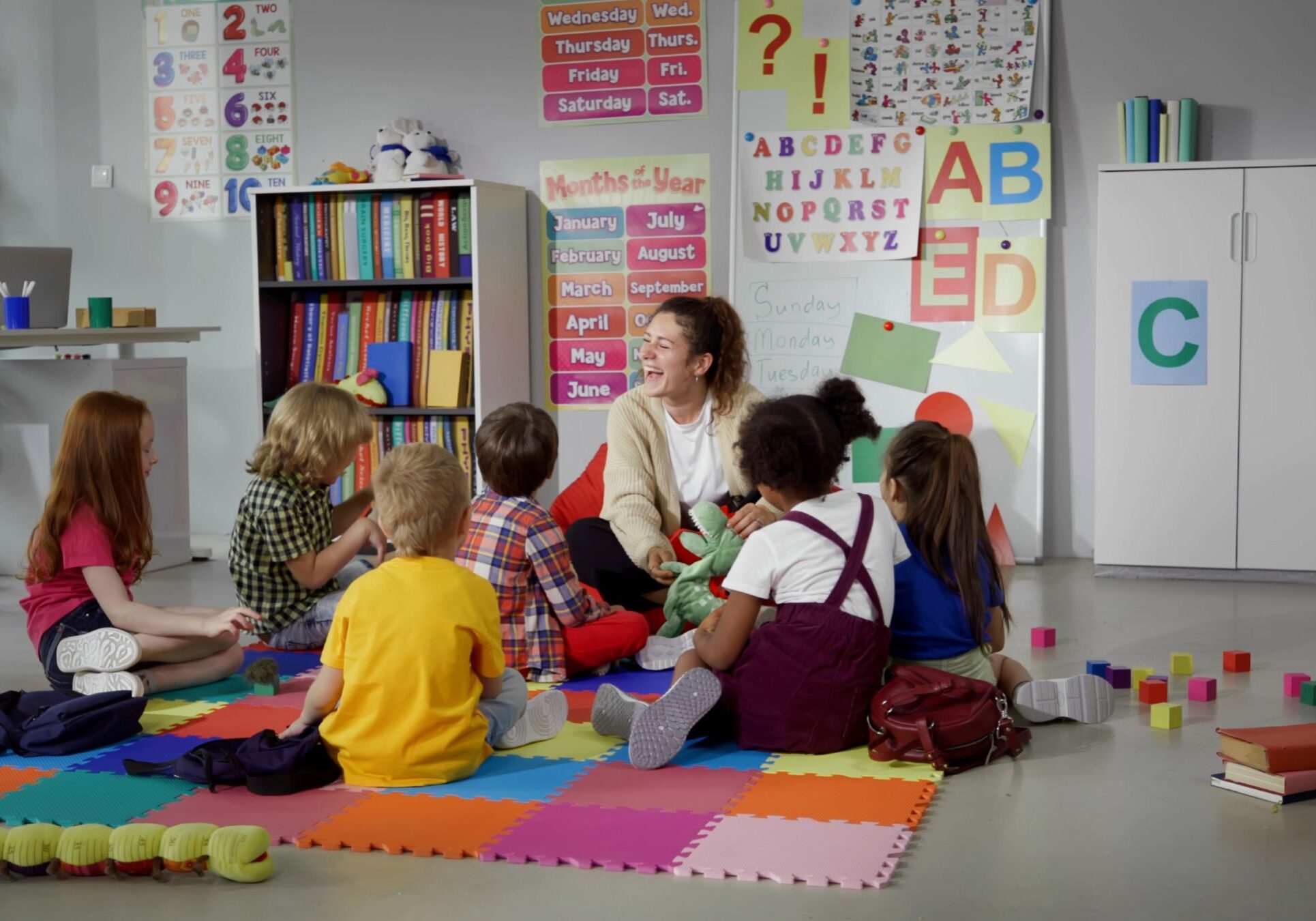 Preschool students engaging in daily circle time to build social skills and community in a well-equipped Head Start classroom