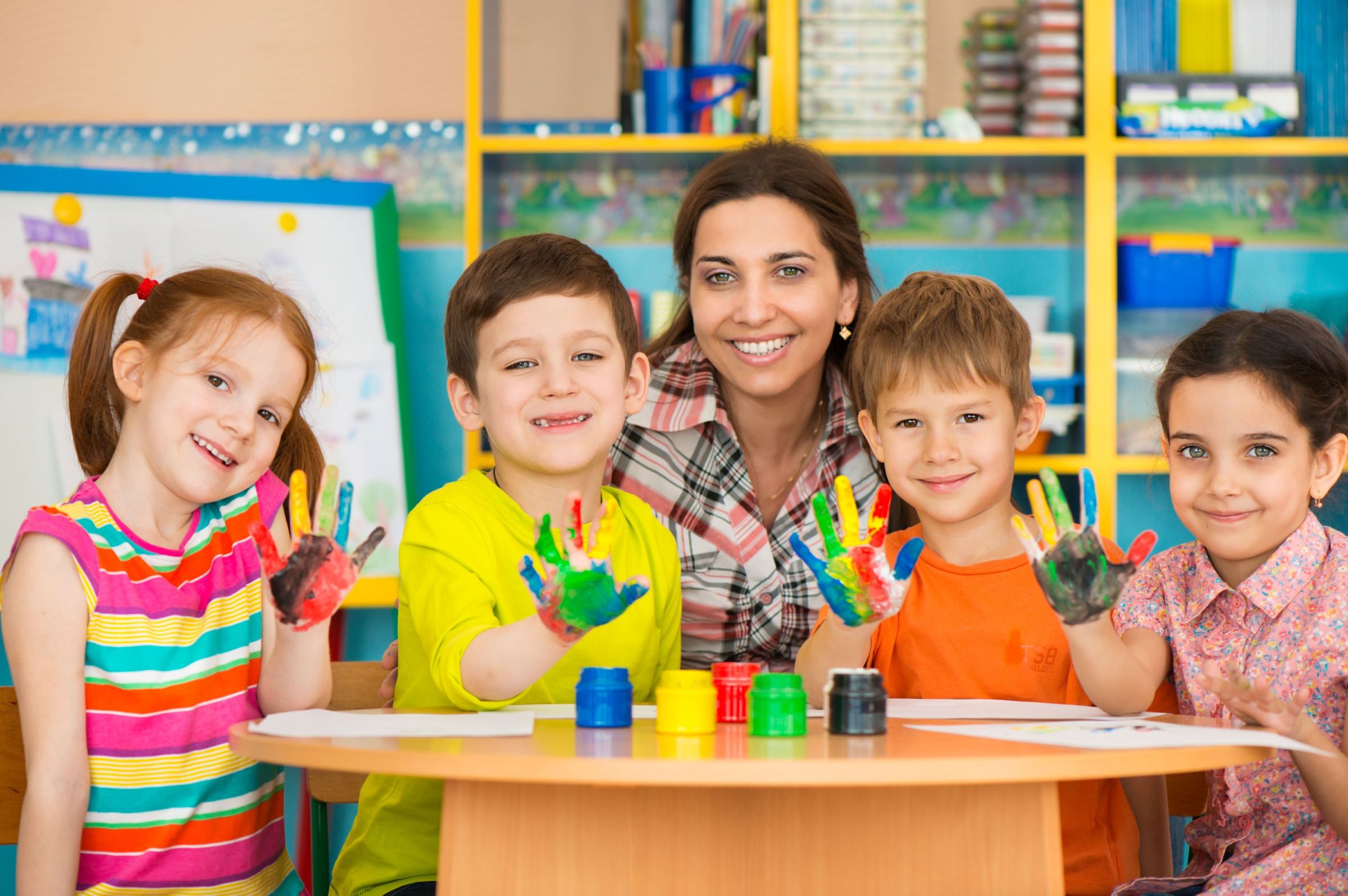 A joyful and inclusive classroom setting where teachers and students engage in creative, play-based learning